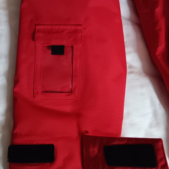 The iconic Abercrombie & Kent expedition red winter coat with blue lining. - Picture 9 of 10